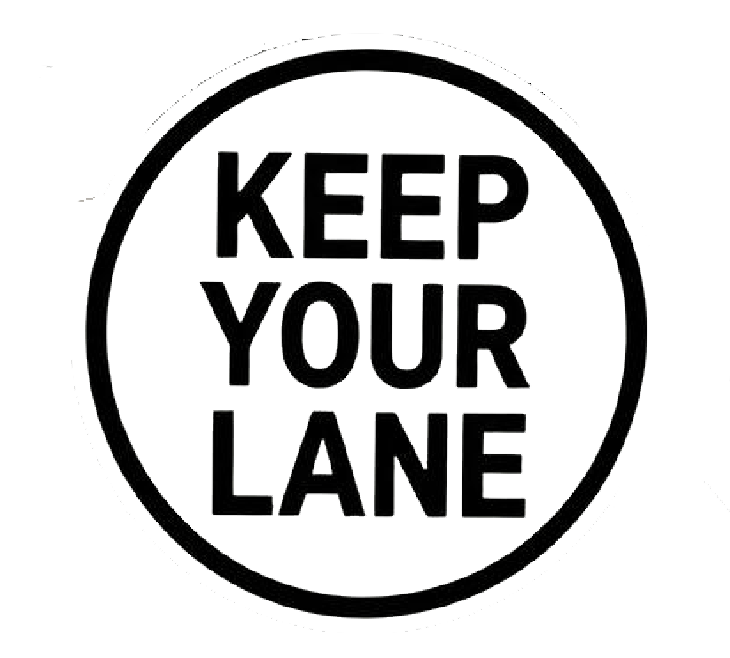 Black and white circular decal featuring the bold words “KEEP YOUR LANE” stacked in three lines.
