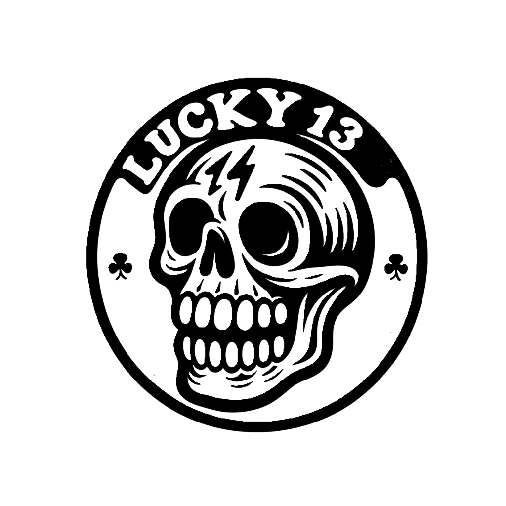 Black and white Lucky 13 skull decal featuring a grinning skull, playing card club symbols, and a circular border.