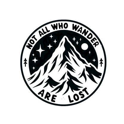 Round black and white mountain decal with stars, moon, pine trees, and the words “Not All Who Wander Are Lost.”