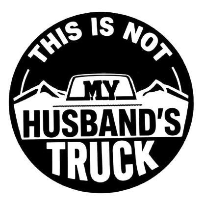 Black and white circular humorous decal featuring mountain graphics and the text “THIS IS NOT MY HUSBAND'S TRUCK.”