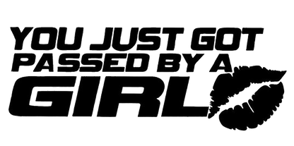 Black automotive decal reading “You Just Got Passed by a Girl” in bold italic lettering with a stylized tire-track graphic.